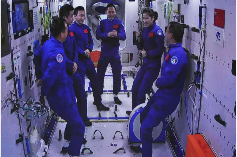 Chinese spaceship with 3 aboard docks with space station
