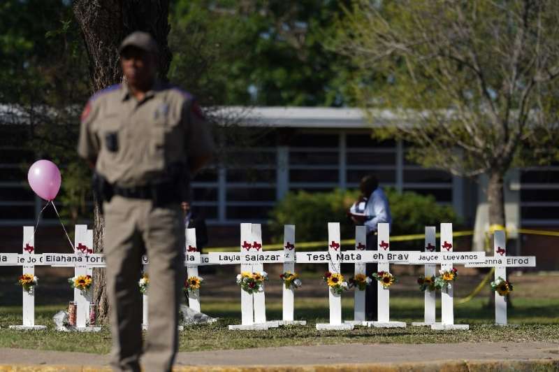 Crosses sit outside Robb Elementary School on May 26, 2022, in remembrance of those killed in Uvalde, Texas