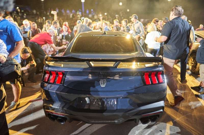Crowds surround the new Ford Mustang Dark Horse following its debut at the North American International Auto Show in Detroit, Mi