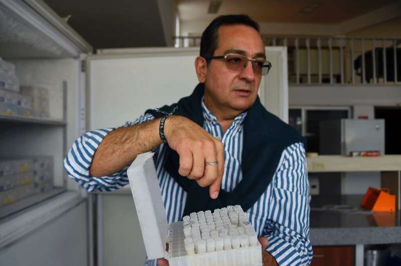 Ecuadoran scientist Javier Carvajal shows vials containing the resurrected strain of yeast from Latin America's oldest beer