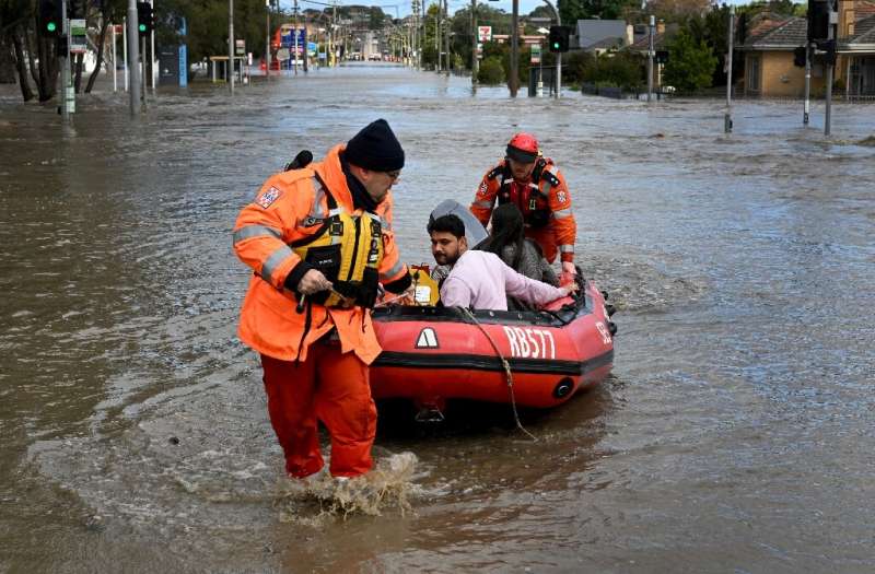 Emergency workers evacuate residents from flooded properties in the Maribyrnong suburb of Melbourne