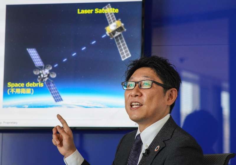 Engineer Tadanori Fukushima of satellite operator SKY Perfect JSAT envisions using a laser beam to vaporise the surface of space