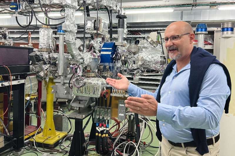 Facility coordinator Roberto Corsini shows off a 40-metre linear particle accelerator at CERN which could push the boundaries of