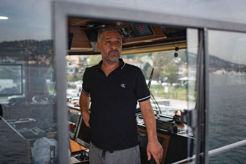 Fierce competition: Captain Soner Karadeniz on the bridge of his fishing boat