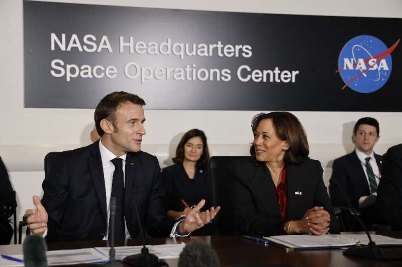 French President Emmanuel Macron at NASA headquarters in Washington with US Vice President Kamala Harris