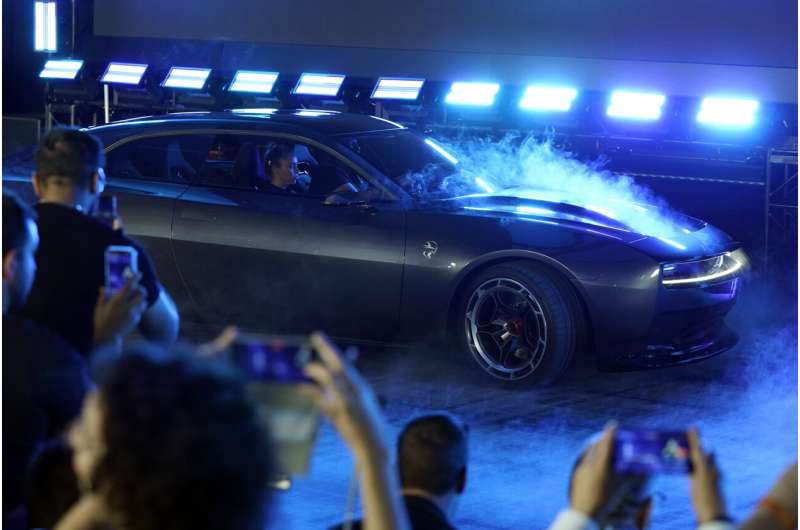Gas-powered muscle cars drive into the sunset, turn electric