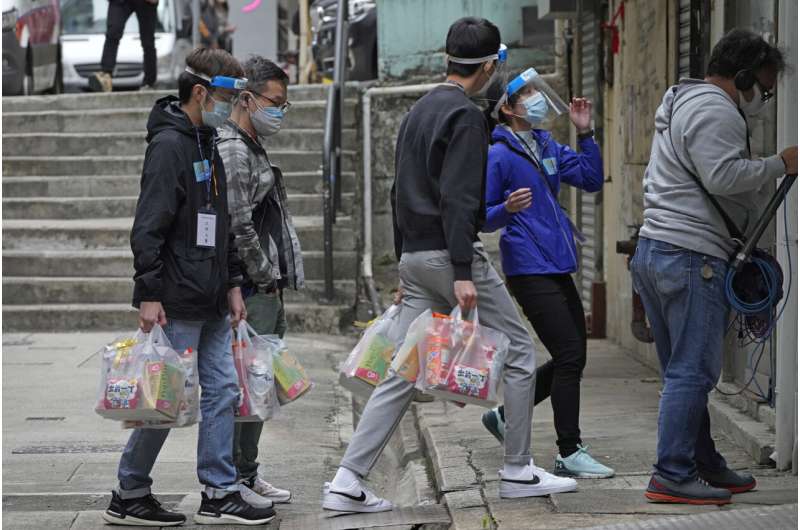 Hong Kong urges testing, Shanghai struggles under lockdown