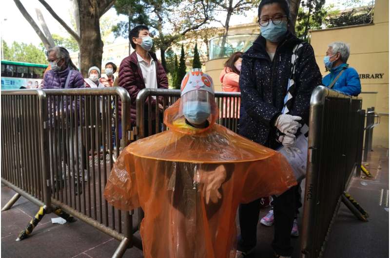 Hong Kong's new virus cases top 10,000 in spiraling outbreak