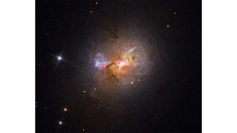 HUBBLE FINDS A BLACK HOLE IGNITING STAR FORMATION IN A DWARF GALAXY