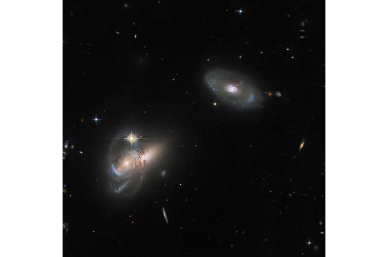 Hubble images a complex galactic trio