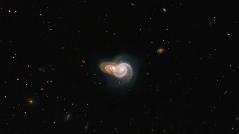 Hubble sees two overlapping galaxies