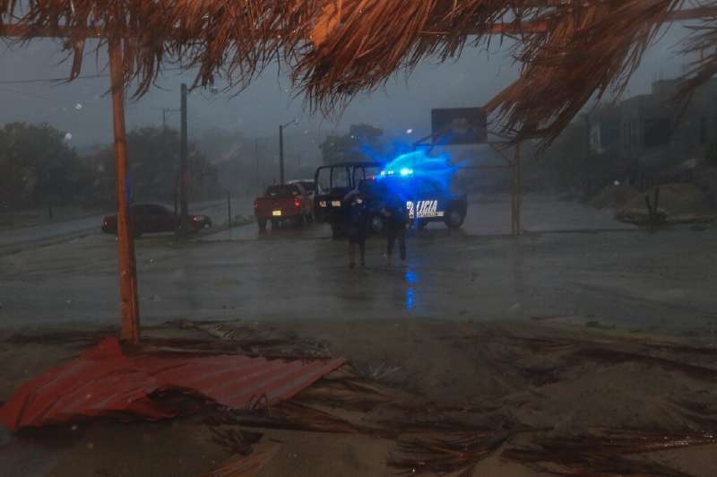 Hurricane Agatha, the first of the Pacific season, dumped heavy rain on coastal resorts including Huatulco in southwest Mexico