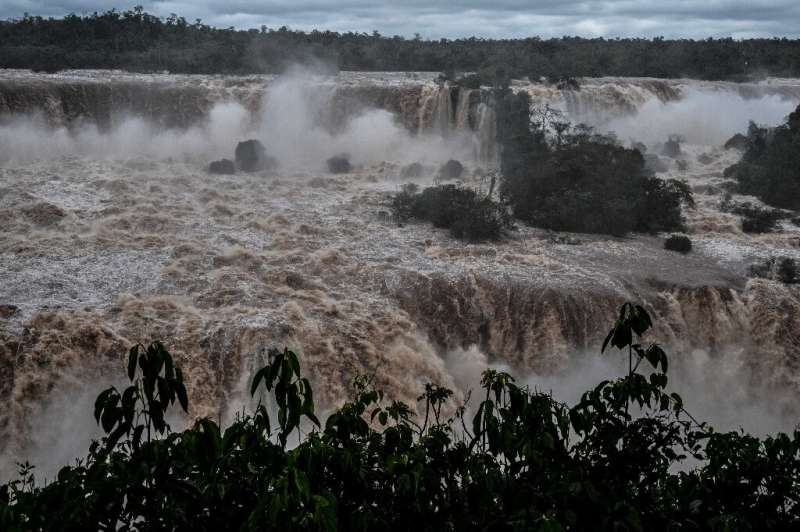 Iguazu, among the world's biggest waterfalls, has nearly 10 times the usual water volume after heavy rains in southern Brazil