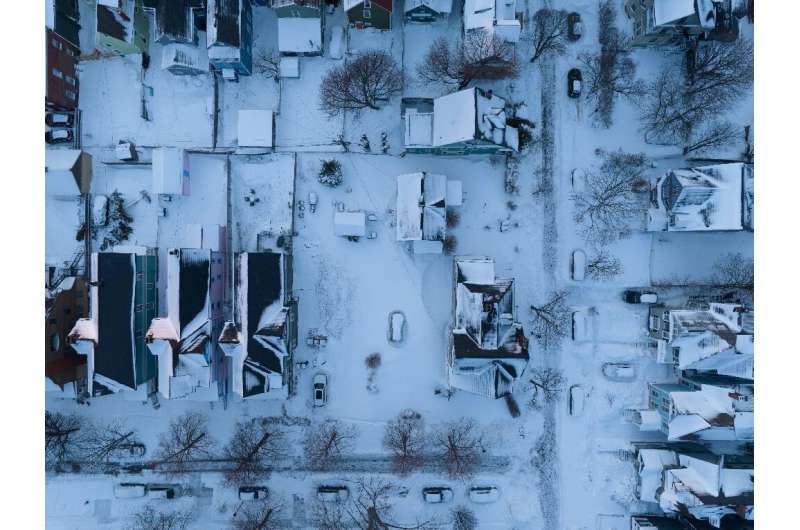 In this aerial photo, cars are still buried in the blizzard’s snow in Buffalo, New York, on December 28, 2022