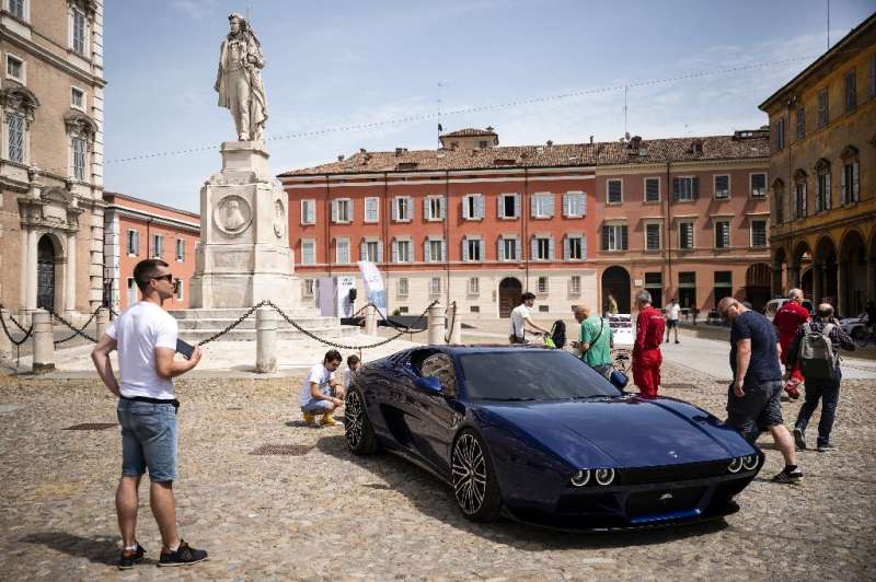 Industry types and fans flock to Modena to talk business and admire the spectacular cars and bikes around town