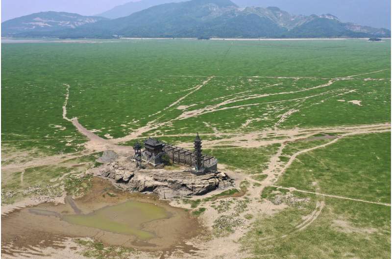 Its largest lake is so dry, China digs deep to water crops