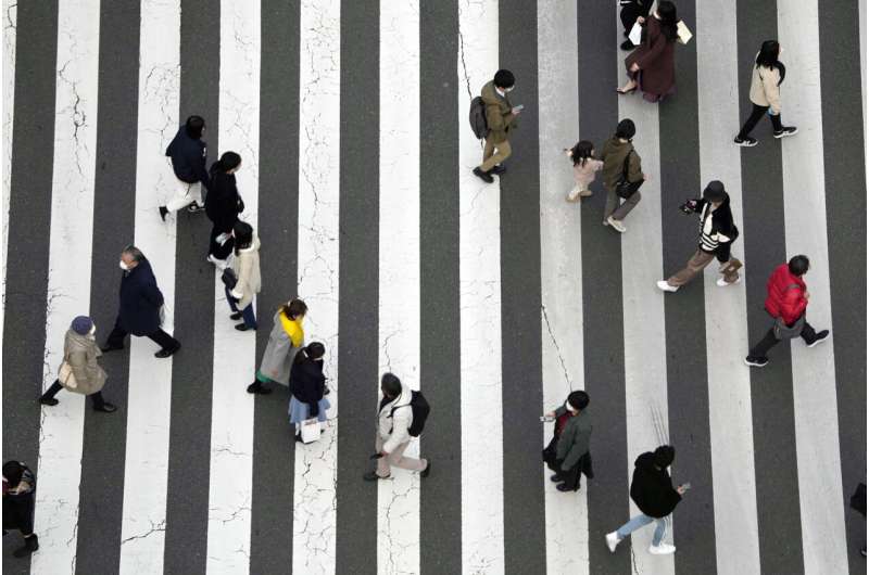 Japan ready to expand virus restrictions as infections surge