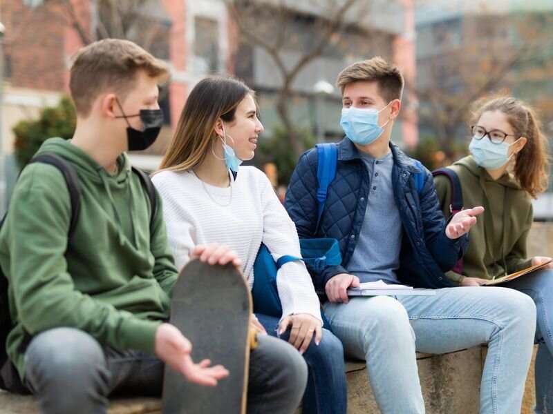 Keep wearing masks a while longer, CDC director says