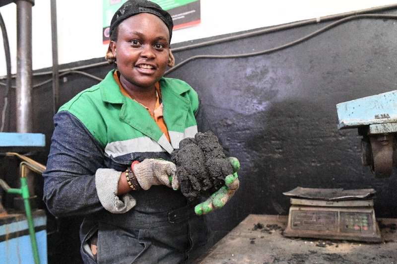 Kenyan engineer and inventor Nzambi Matee moulds a sludge made from shredded plastic and sand into eco-friendly bricks that are 