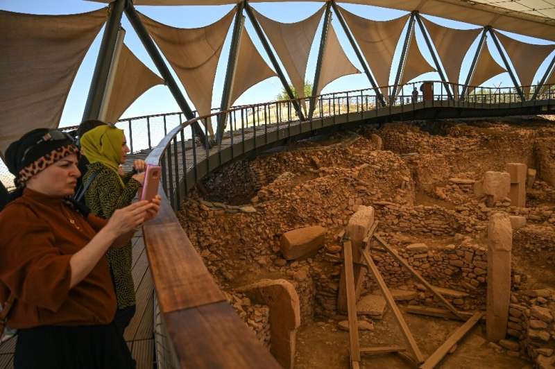 Major draw: Visitors take pictures at the archaeological site of Gobekli Tepe near Sanliurfa, Turkey