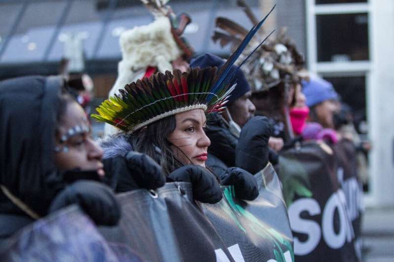 Members of the indigenous community demonstrate against the United Nations Biodiversity Conference (COP15) during the March for 