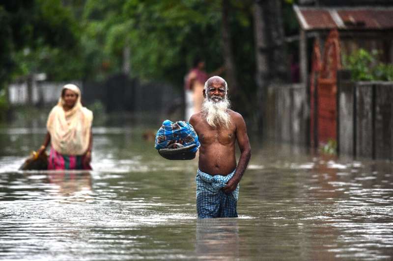 More than 100,000 villagers have taken refuge in aid shelters in Assam