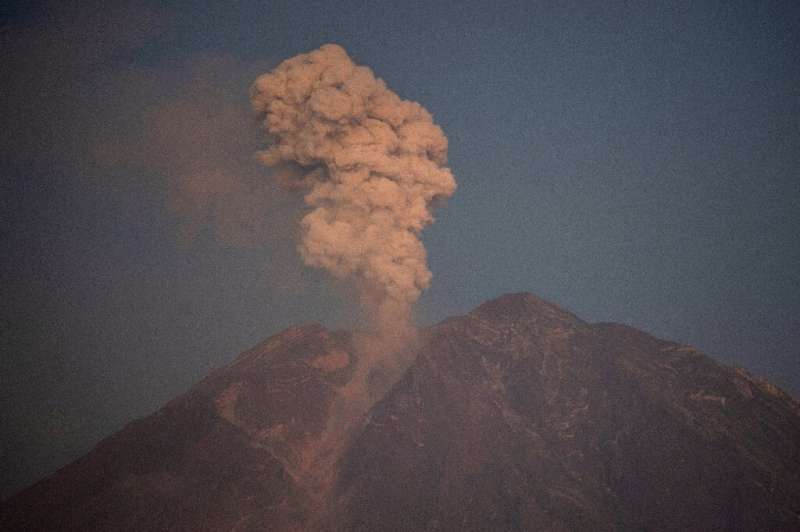 Mount Semeru spews smoke and ash in Lumajang, Indonesia, on Monday