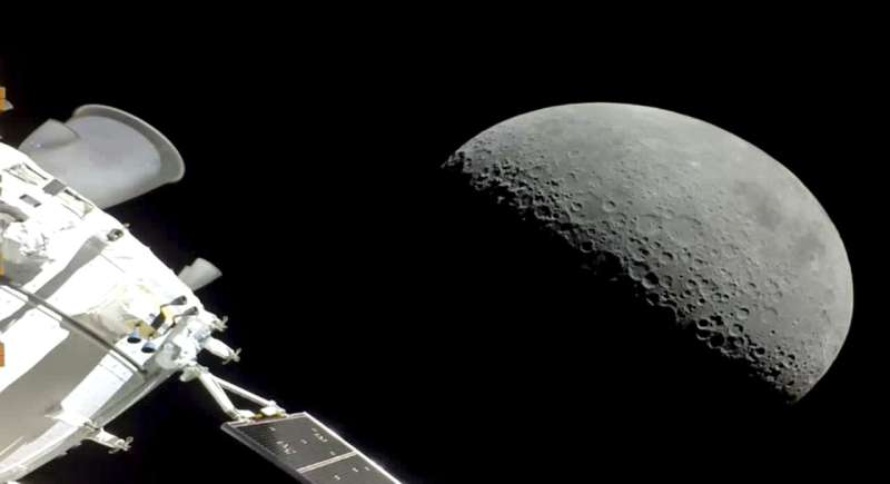 NASA capsule flies over Apollo landing sites, heads home