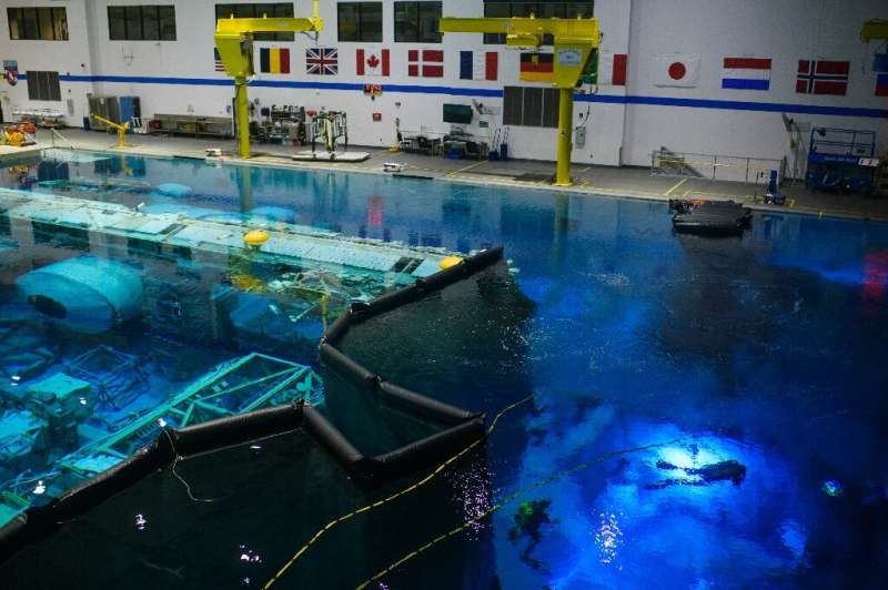NASA's giant astronaut training pool contains a replica of the International Space Station -- and a simulated lunar surface