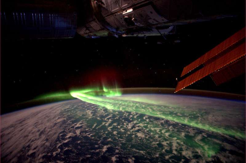 North Pole solar eclipse excited auroras on the other side of the world