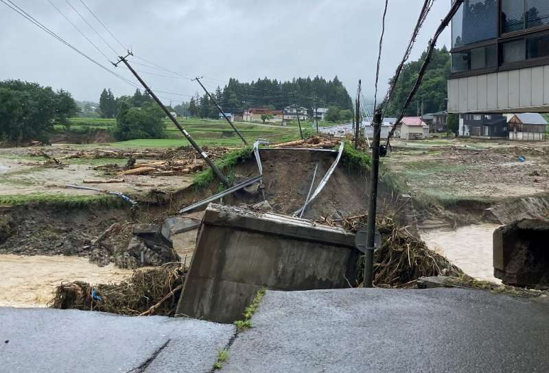 Omaki Bridge, which connects to the town of Iide, Yamagata Prefecture, collapsed after a river flooded