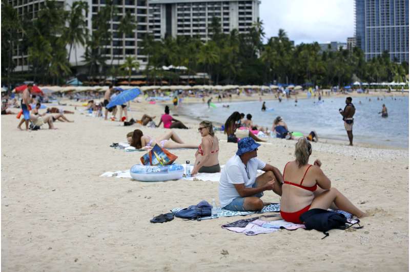 Pandemic-weary Americans plan for summer despite COVID surge