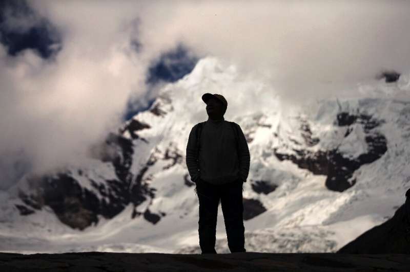 Peruvian farmer Saul Luciano Lliuya looks at the Palcaraju mountain where his Huaraz home is under threat from a melting glacier