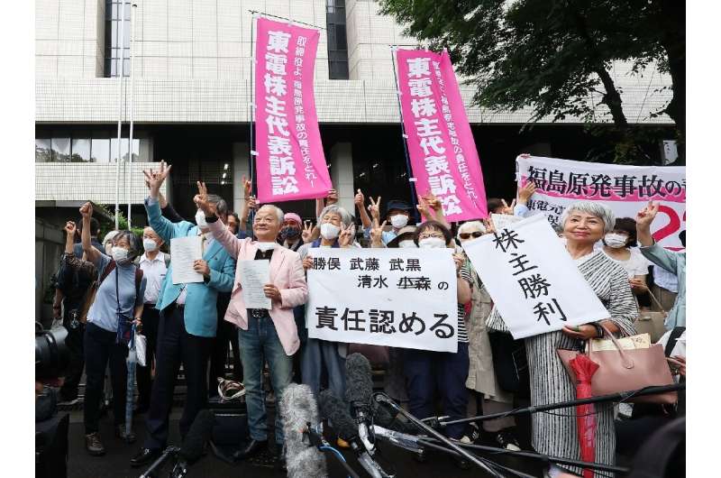 Plaintiffs and their lawyers hailed the ruling outside a Tokyo court