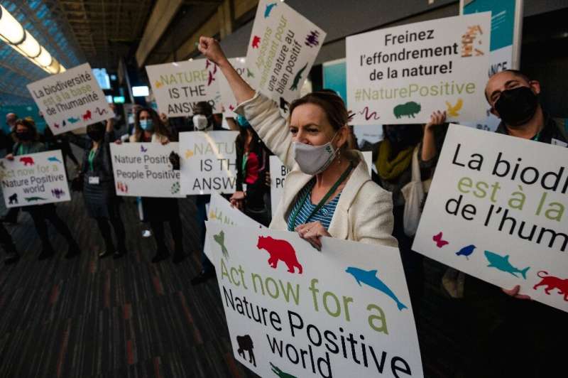 Protesters gathered inside the halls of the COP15 summit on its first day to demand strong action on protecting global biodivers