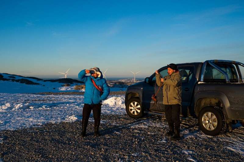 Reindeer herders Leif Arne Jama (R) and his brother John Kristian say the Storheia wind park deprives them of the best of their 