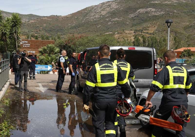 Rescue workers at a campground in Coggia, Corsica, where a 13-year-old girl was killed Thursday when a tree fell on her bungalow