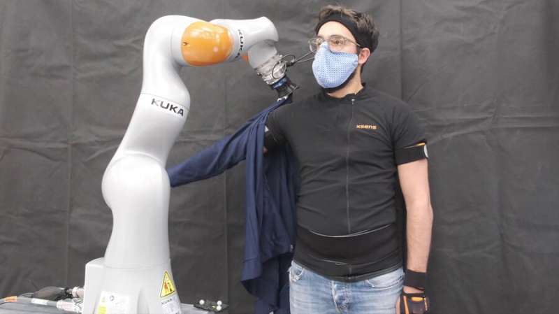 Robots dress humans without the full picture | MIT News