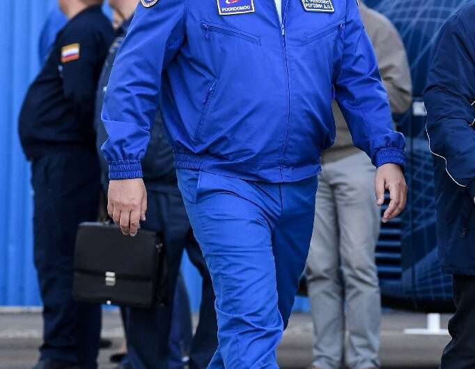 Russian space agency Roscosmos head Dmitry Rogozin walks prior to the launch of the Soyuz MS-10 spacecraft in Kazakhstan in Octo
