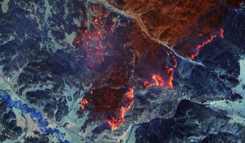Satellite image showing color infrared overview of fire lines south of Lame Deer, Montana in August 2021