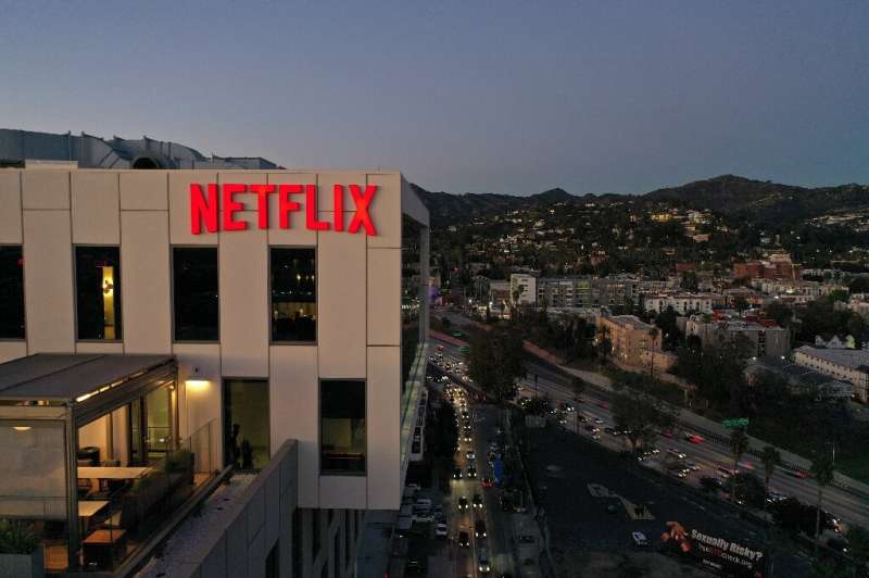 Shares of Netflix sank more than 20 percent as investors recalculate valuations on companies that soared on torrid growth earlie