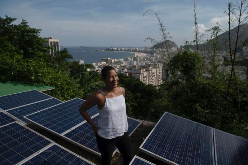 Solars panels installed atop roofs in Rio's Babilonia favela have helped residents lower electricity costs