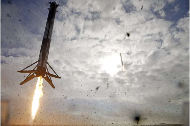 SpaceX nails booster landings after foggy military launch