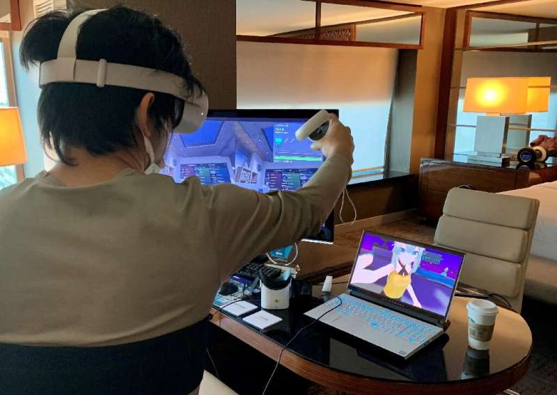 Takuma Iwasa, CEO of Shiftall, demonstrates Haritora X, a full body tracking system for virtual reality, at Consumer Electr