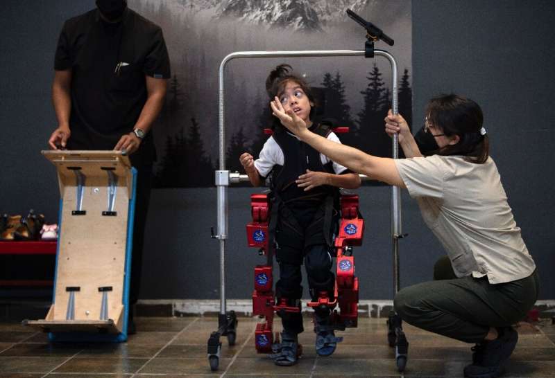The exoskeleton was designed by Spanish professor Elena Garcia Armada to enable children who use wheelchairs to walk during musc
