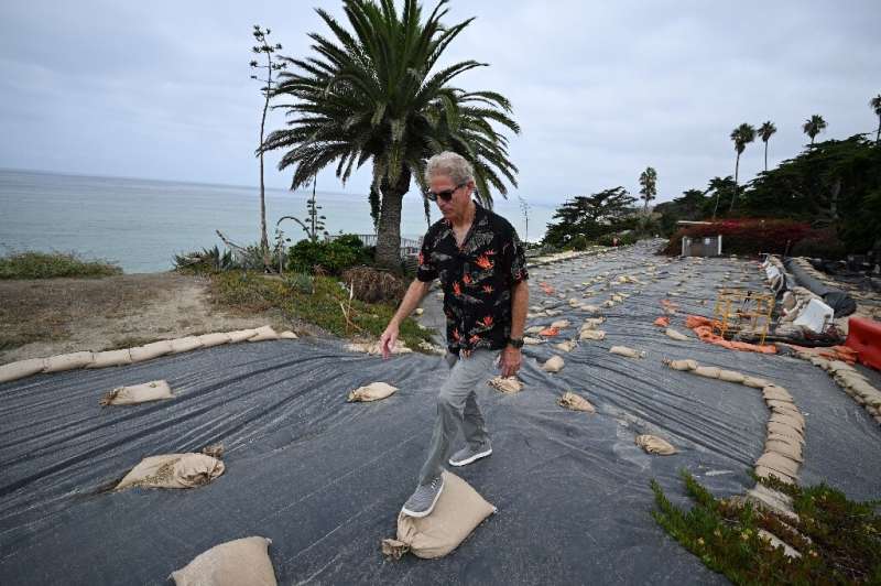 The hillside is being eaten away and multi-million dollar homes are sliding towards the sea