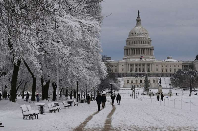 The US Capitol towers over the snow-covered Mall after a winter storm over the capital region on January 3, 2022 in Washington, 