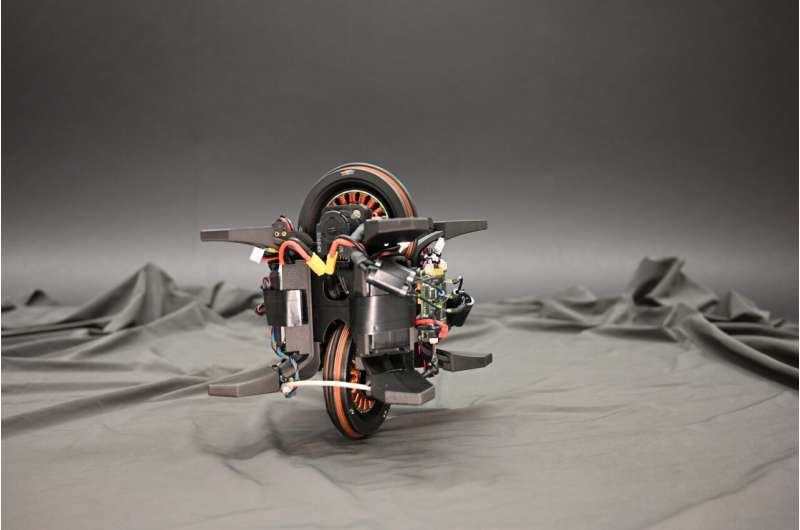 The Wheelbot: A symmetric unicycle with jumping reaction wheels