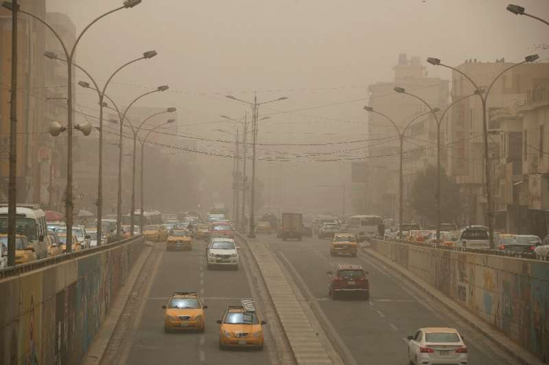 Thick white dust covers the Iraqi capital Baghdad with visibility down to a few hundred metres on June 13, 2022