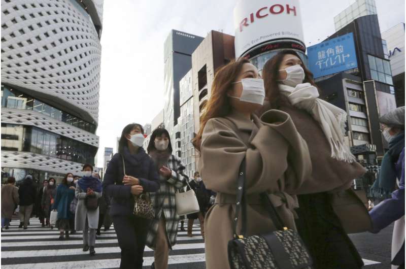 Tokyo reports record virus cases as Japan tightens measures
